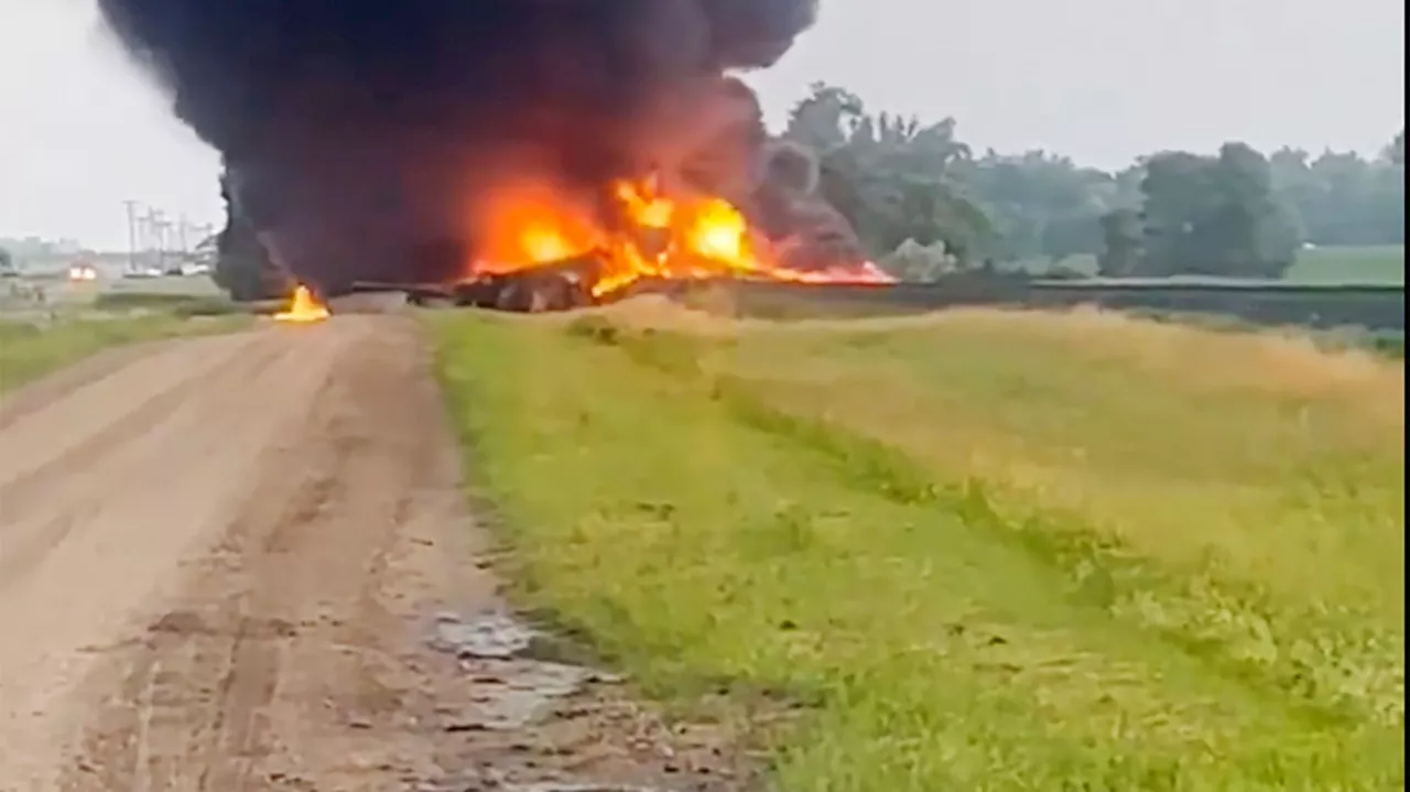 Rail cars carrying hazardous material derail and catch fire in North Dakota