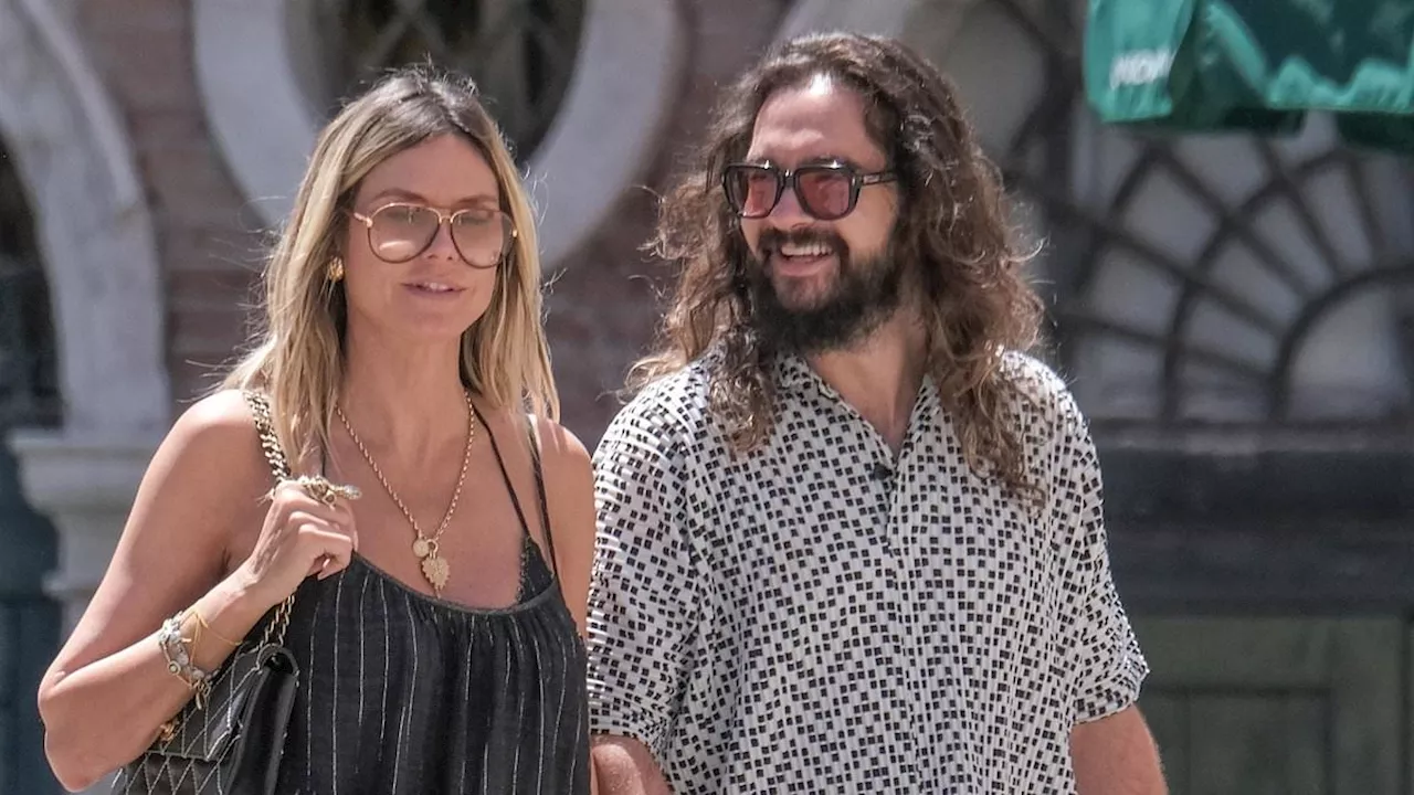 Heidi Klum receives a loving pat on the backside by husband Tom Kaulitz as they explore historic...