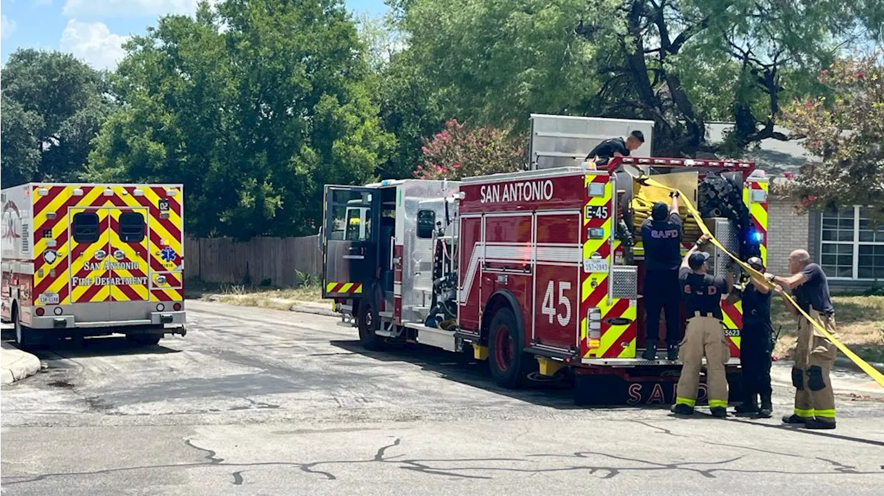 Fire crews battle small house fire on northwest side, officials say