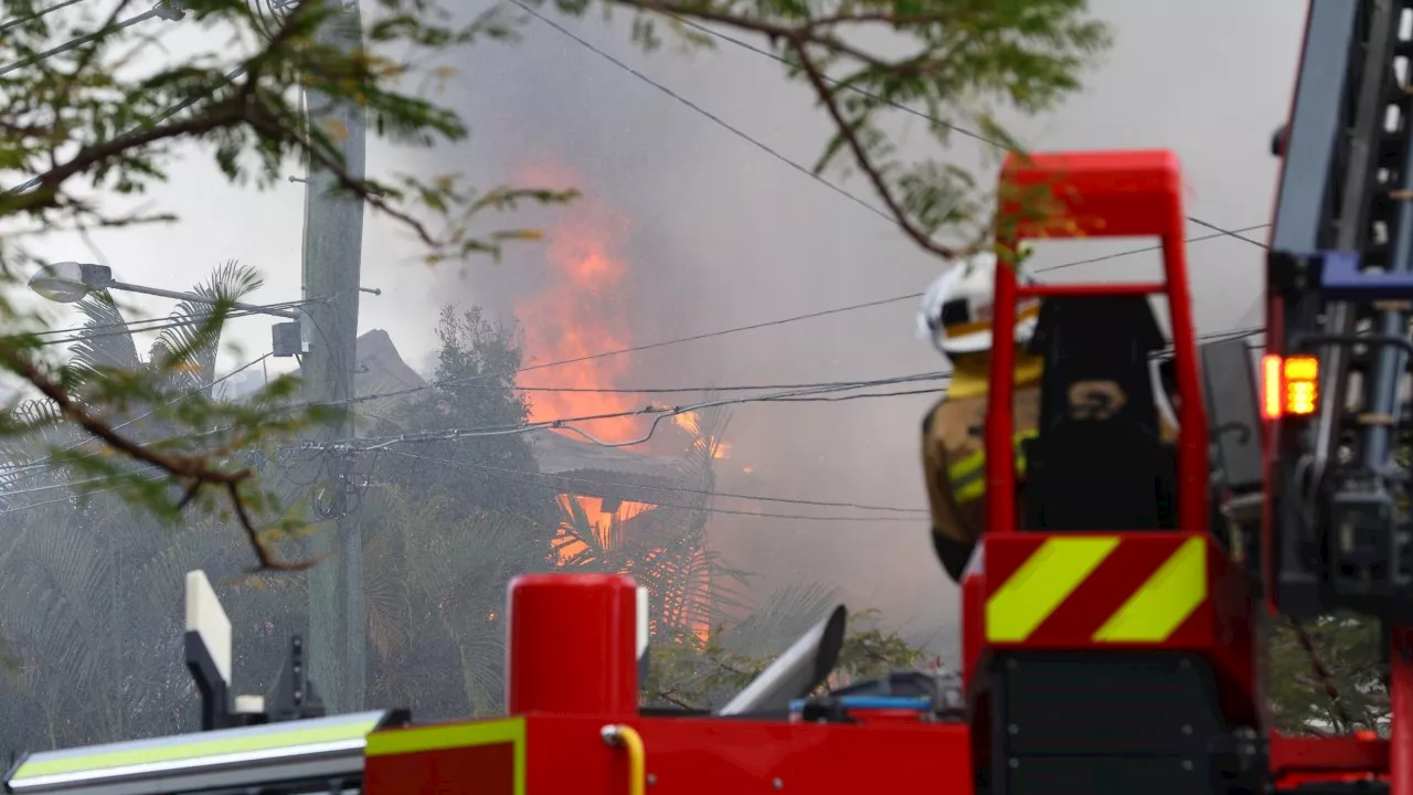 Raging fire destroys three homes in Brisbane suburb of Grange