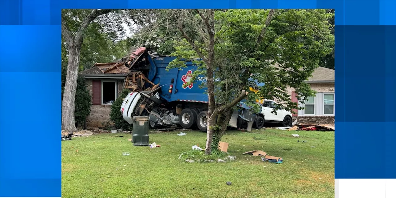 One injured after garbage truck slams into Madison home