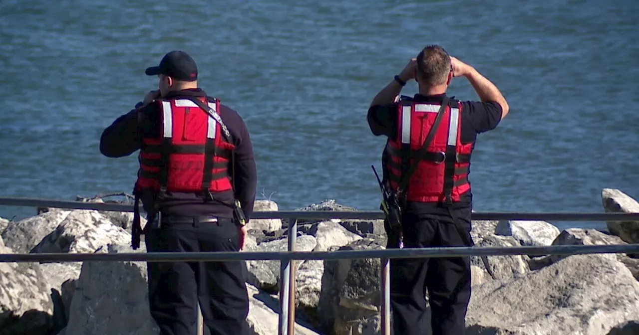 Sheffield Lake firefighters rescue 2 people after boat overturns