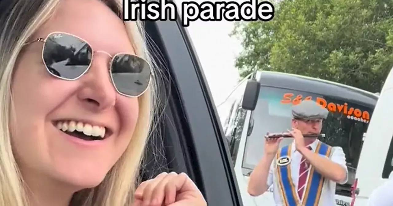 Tourist speaks out after going viral 'getting stuck' in an Orange Order parade