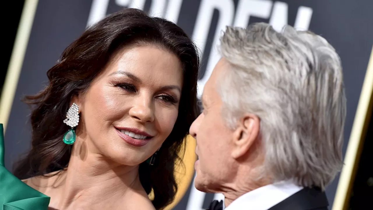 Catherine Zeta-Jones and husband Michael Douglas look so loved-up during star-studded outing