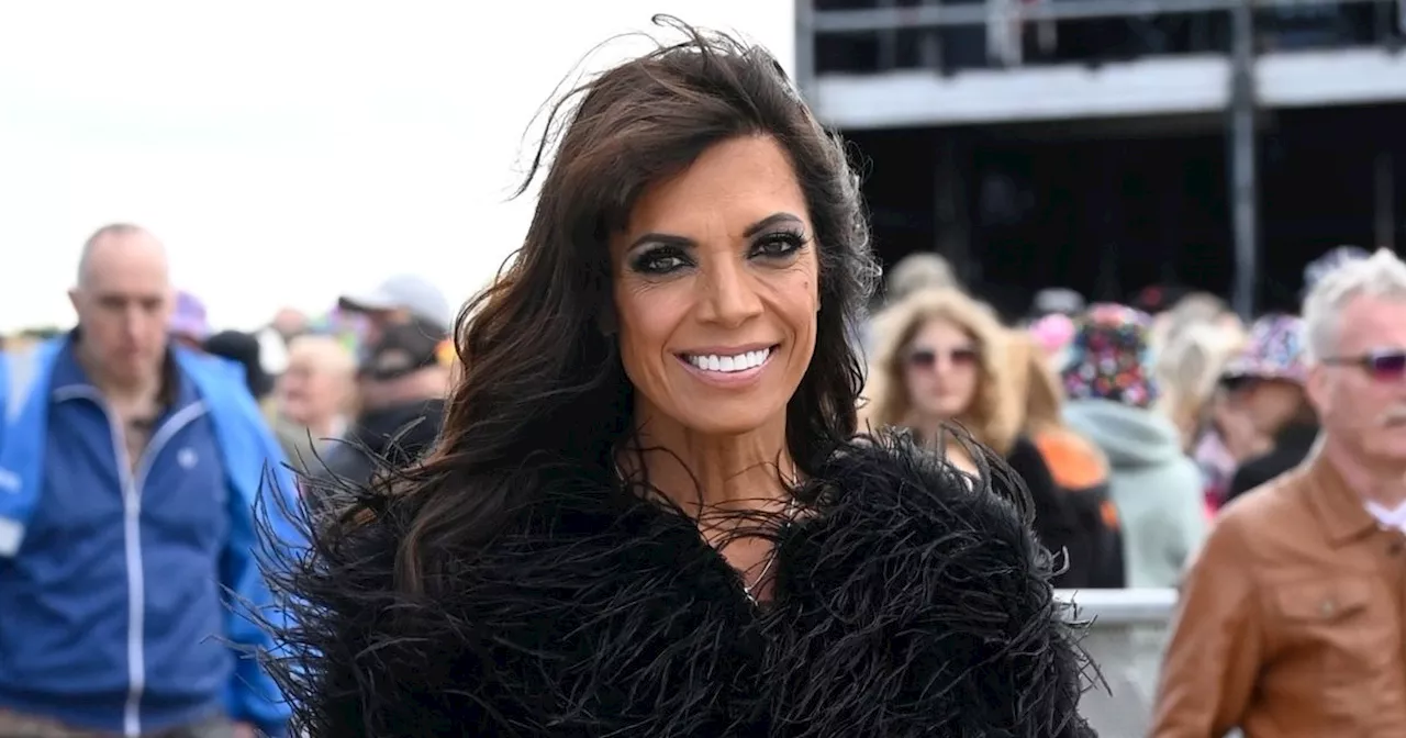 Jenny Powell, 56, looks to be ageing backwards in skimpy hot pants at festival