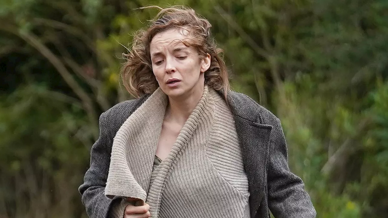 Jodie Comer looks battered and fraught while running away from terrifying zombies as she films 28...