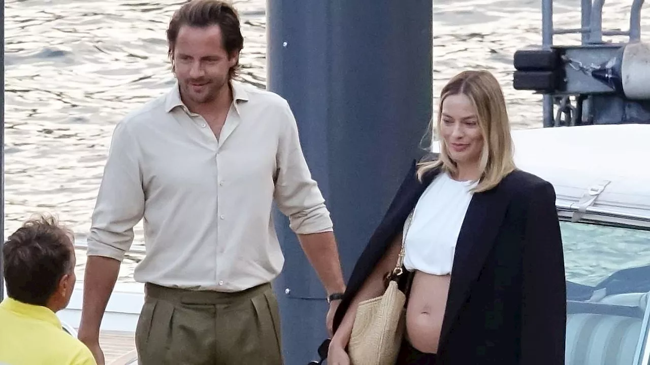 Pregnant Margot Robbie and Tom Ackerley are 'happy the news is out' - as it is revealed they 'really...