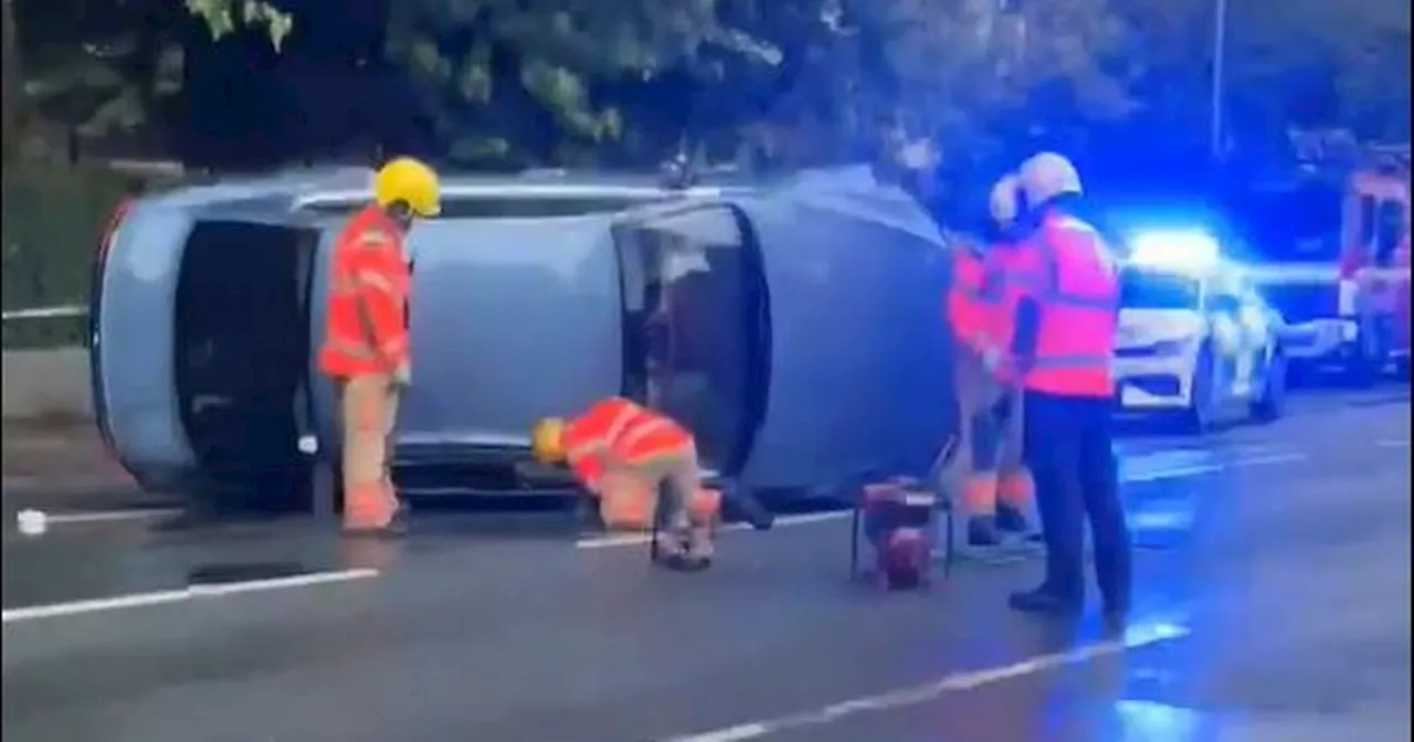 Car is ploughed into lamppost before flipping over