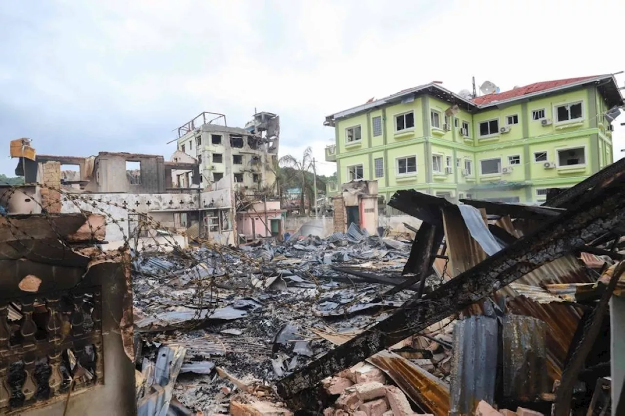 New Myanmar clashes turn town into rubble