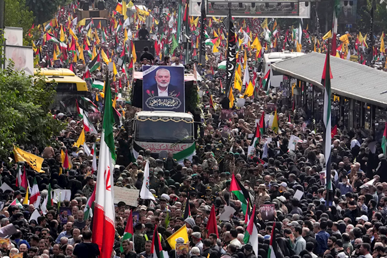 Iran supreme leader prays over coffin of Hamas leader Haniyeh, whose killing risks a wider war