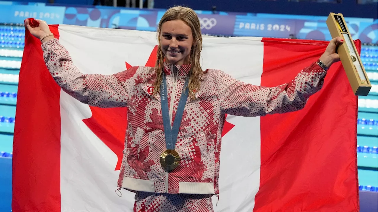 Summer McIntosh wins gold in 200-metre butterfly, sets Olympic record