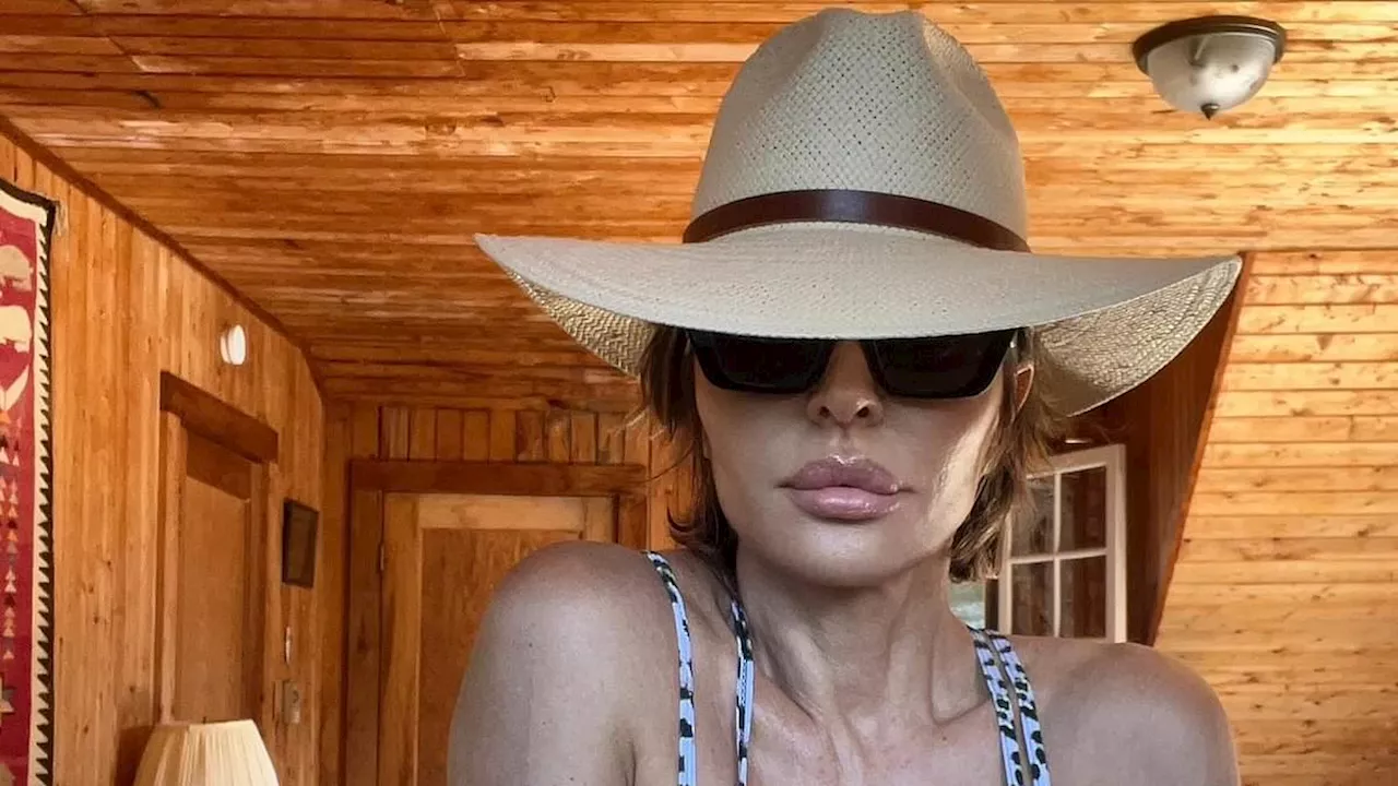 Lisa Rinna, 61, almost spills out of her leopard print cut-out swimsuit while on her annual Canadian...