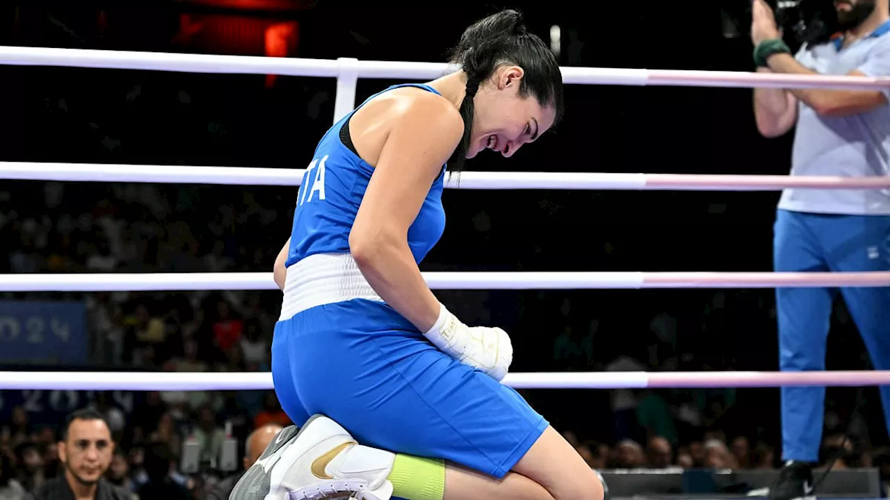 Female boxer yells 'this is unjust' and falls to her knees in tears as she quits fight against...