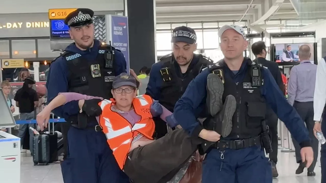 Just Stop Oil eco zealots try to block Heathrow Airport departure gate