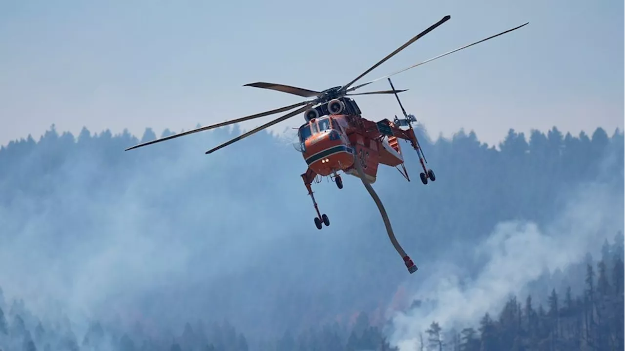 Wildfires encroach on homes near Denver as firefighters face sweltering heat