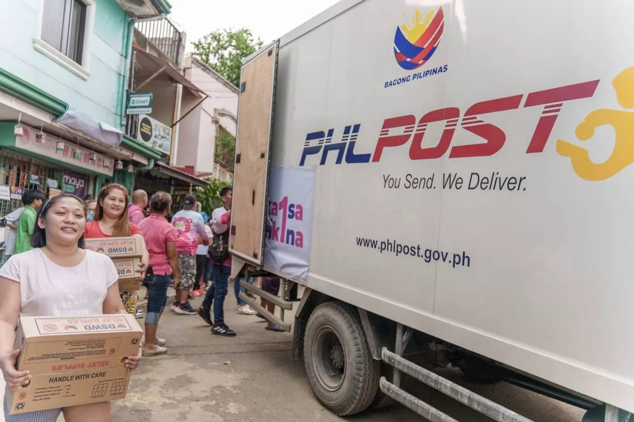 PHLPost delivers DSWD food packs to Marikina residents affected by Typhoon Carina