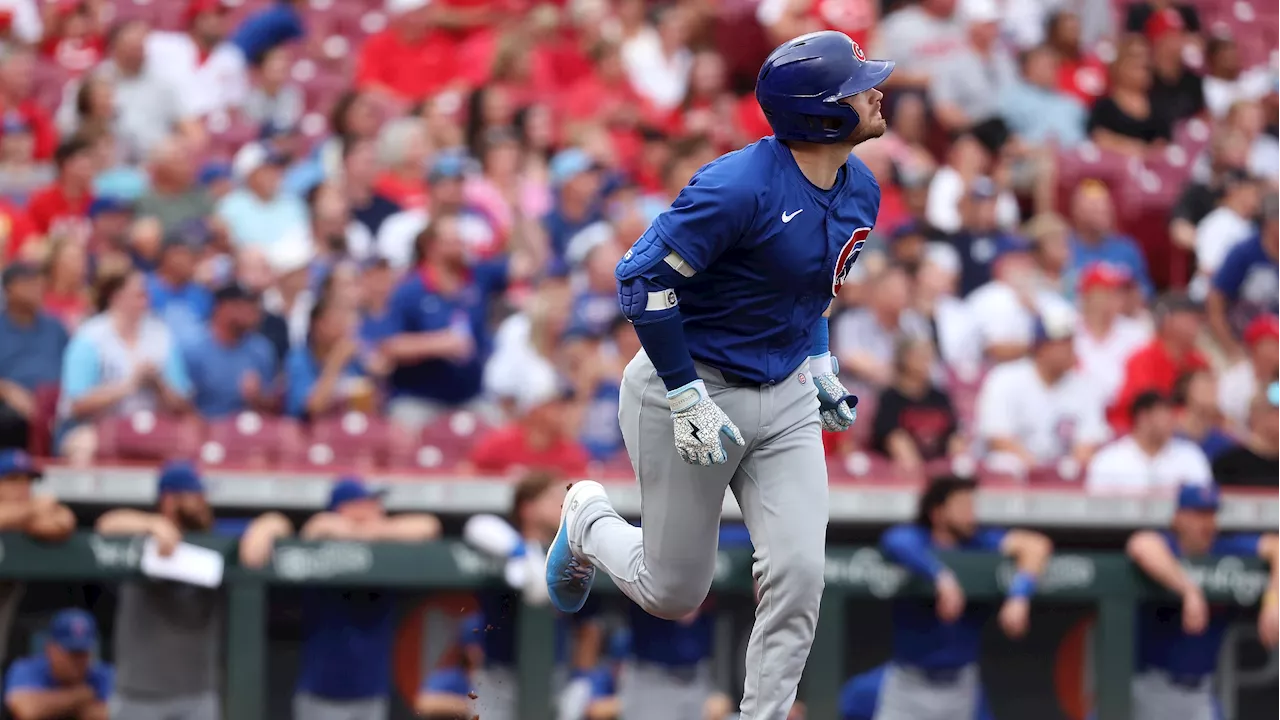 Happ launches 2-run homer and Cubs pound out 17 hits in rout of Reds