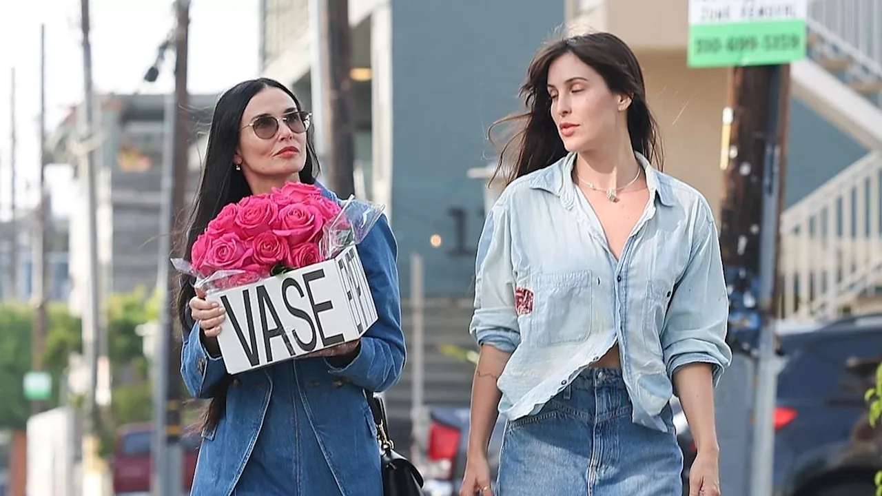 Demi Moore and daughter Scout Willis match in coordinating denim looks while visiting a friend in...