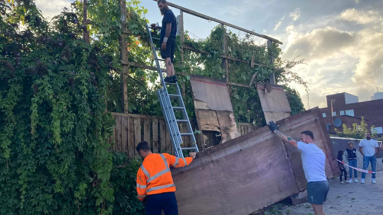 Fury as Banksy is ripped down just HOURS after its unveiling with cops taping off billboard & locals...