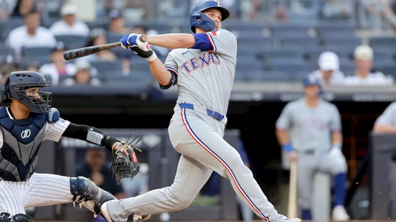 Corey Seager and rookie Cody Bradford lead Rangers past Yankees 9-4 for a doubleheader split