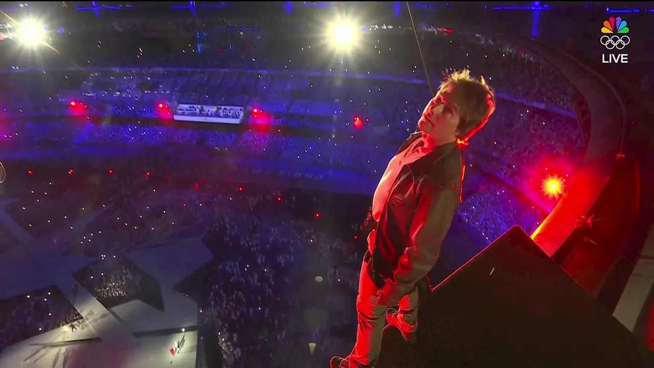 Tom Cruise soars into Closing Ceremony in epic stunt, takes Olympic flag from Simone Biles