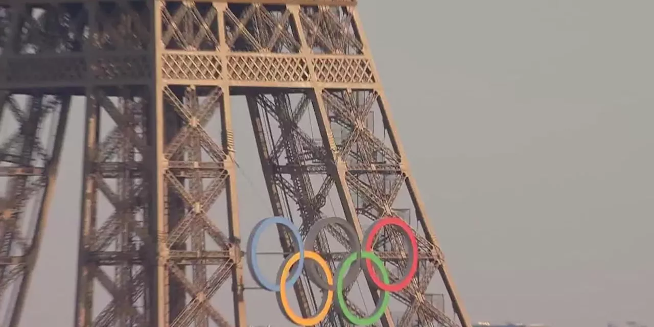 Police arrest shirtless man climbing the Eiffel Tower, prompting an evacuation hours before closing ceremony