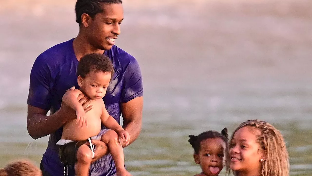 Rihanna and ASAP Rocky swim with children Riot Rose, one, and RZA, two, as they enjoy Barbados...