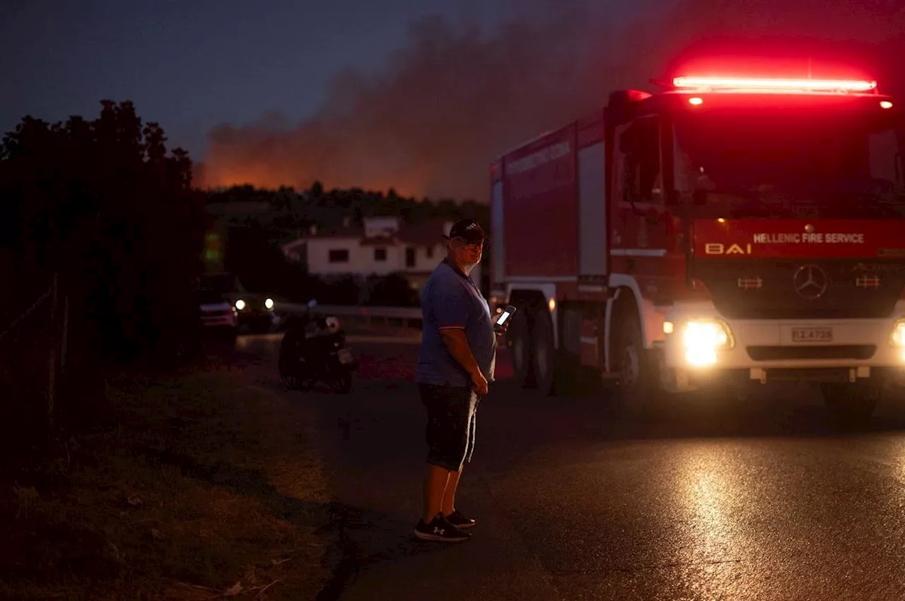 Greek wildfire spreads to edge of Athens; towns, hospitals evacuated