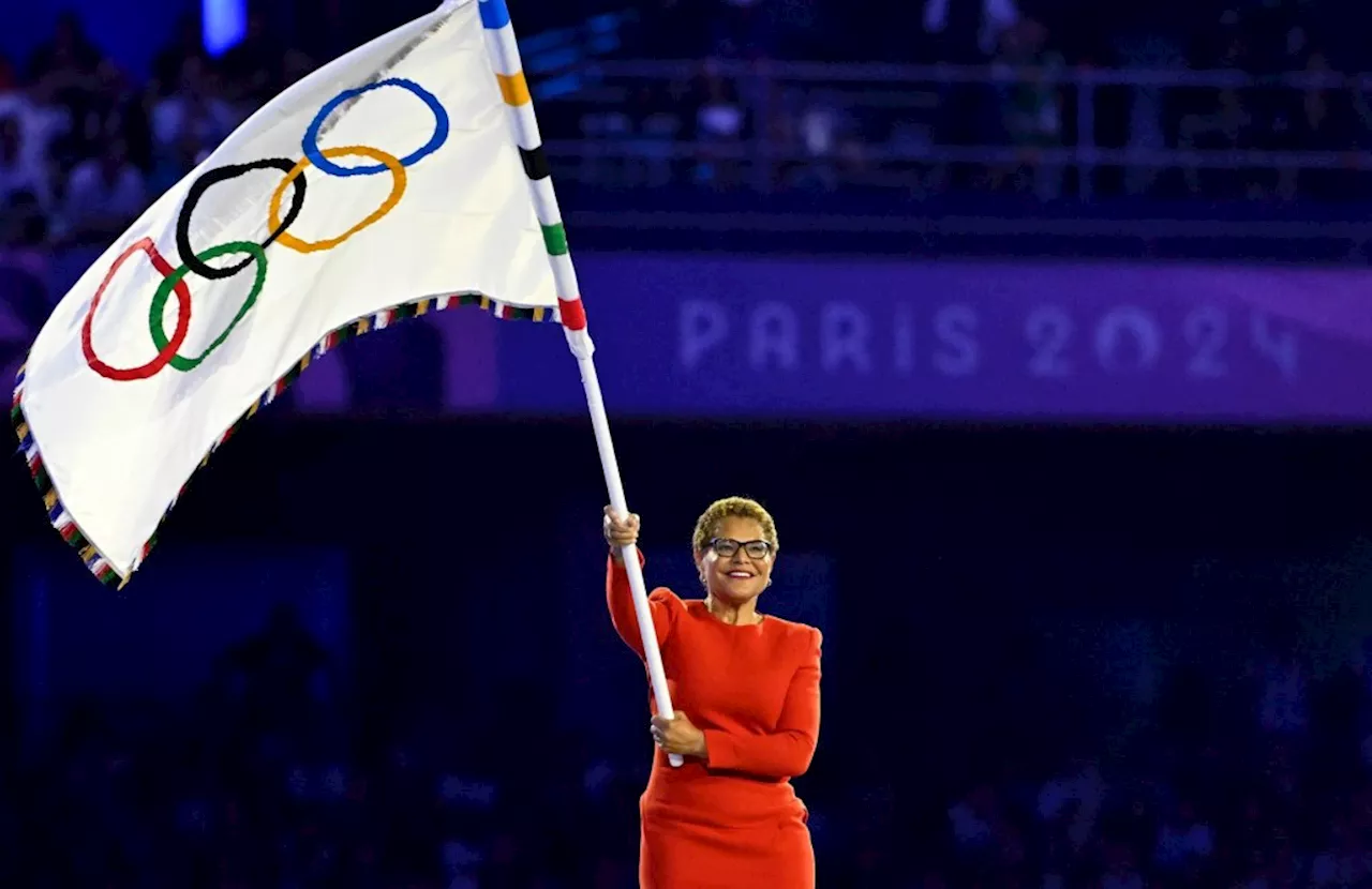 Leaving Paris, Mayor Karen Bass heads back to Los Angeles with the Olympic flag