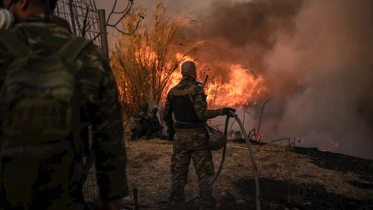 Hundreds of firefighters battle violent wildfires near Athens, as Greece requests European help