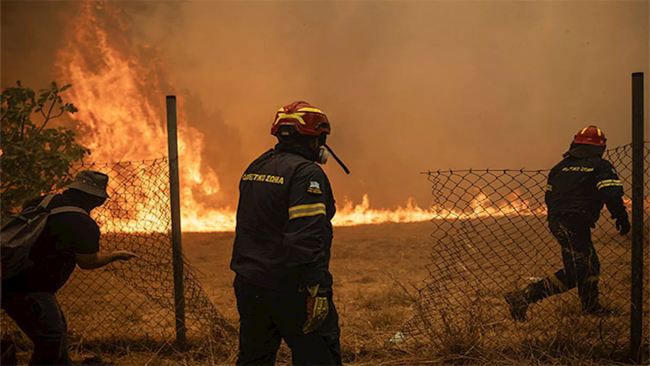 Greece asks EU for help as wildfires near Athens suburbs