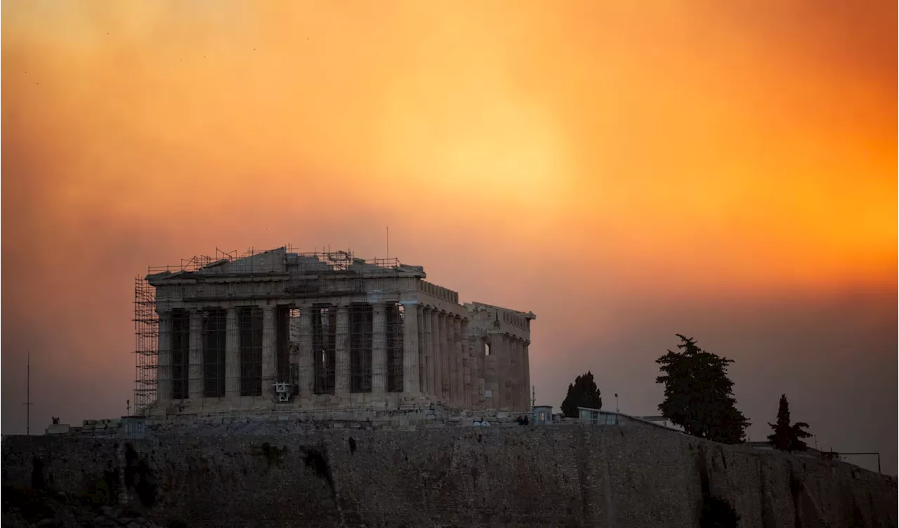 Photos show massive wildfire raging in Greece as residents near Athens forced to flee homes