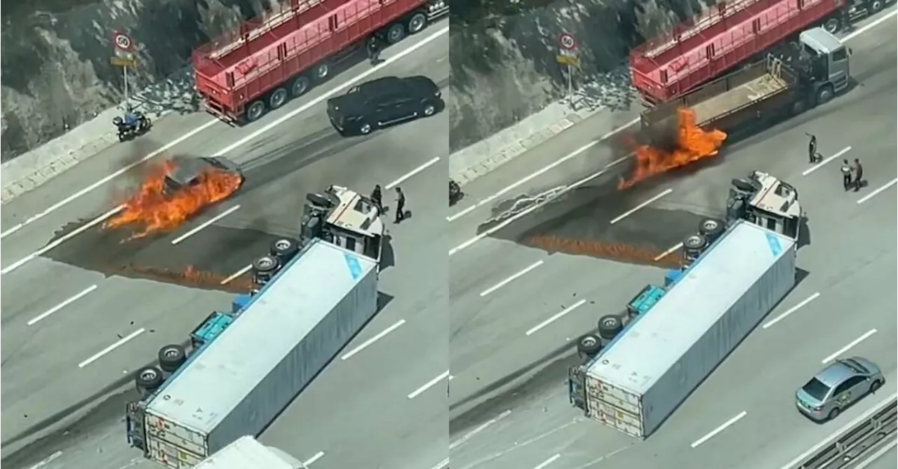 Cars driving over trailer crash fuel leak cause fire – don’t make it worse; avoid, stop if necessary