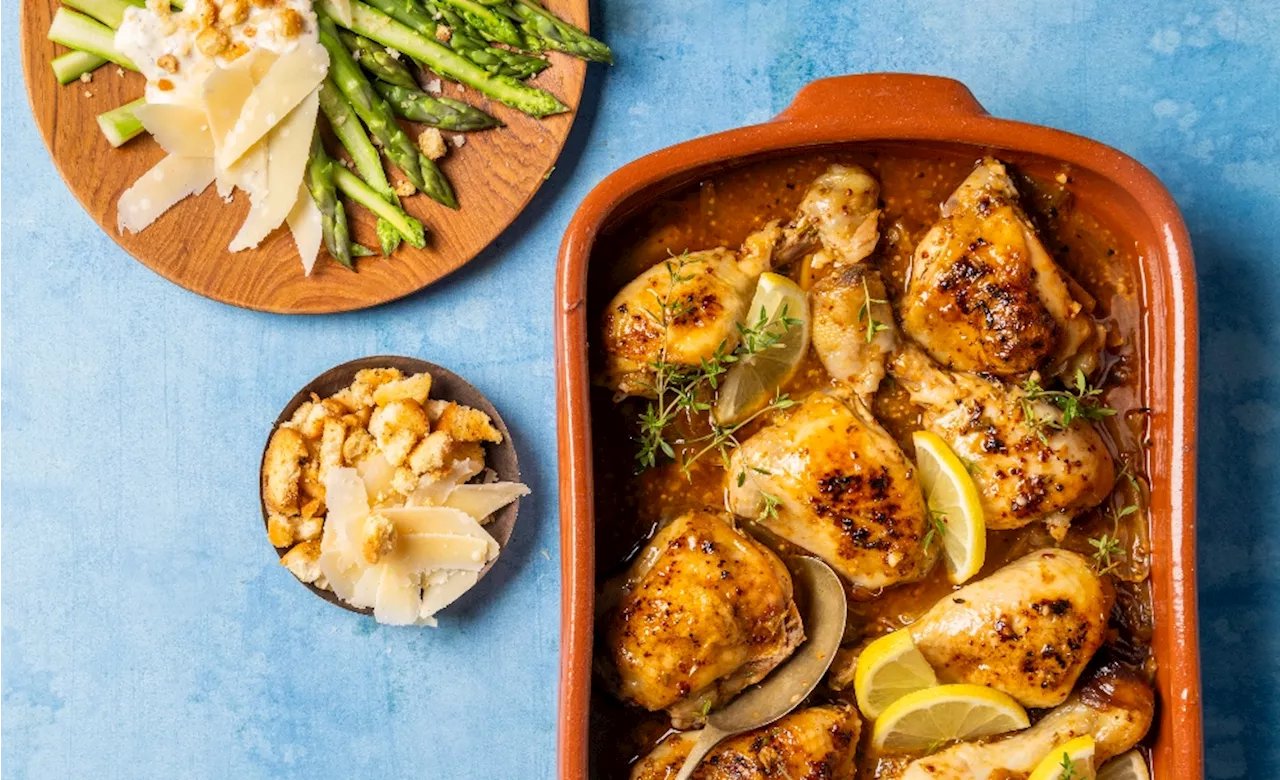 Lemon butter chicken paired with asparagus Caesar salad