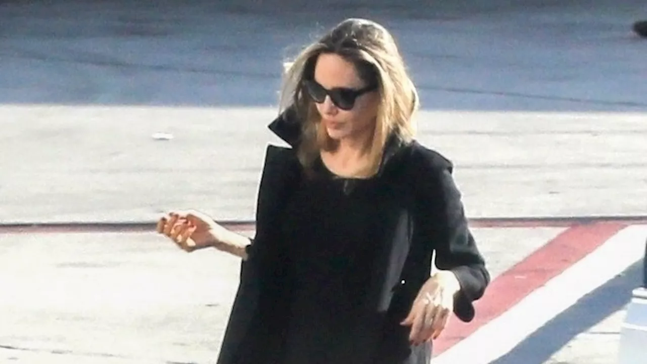 Angelina Jolie Sports An Unexpected Airport Shoe