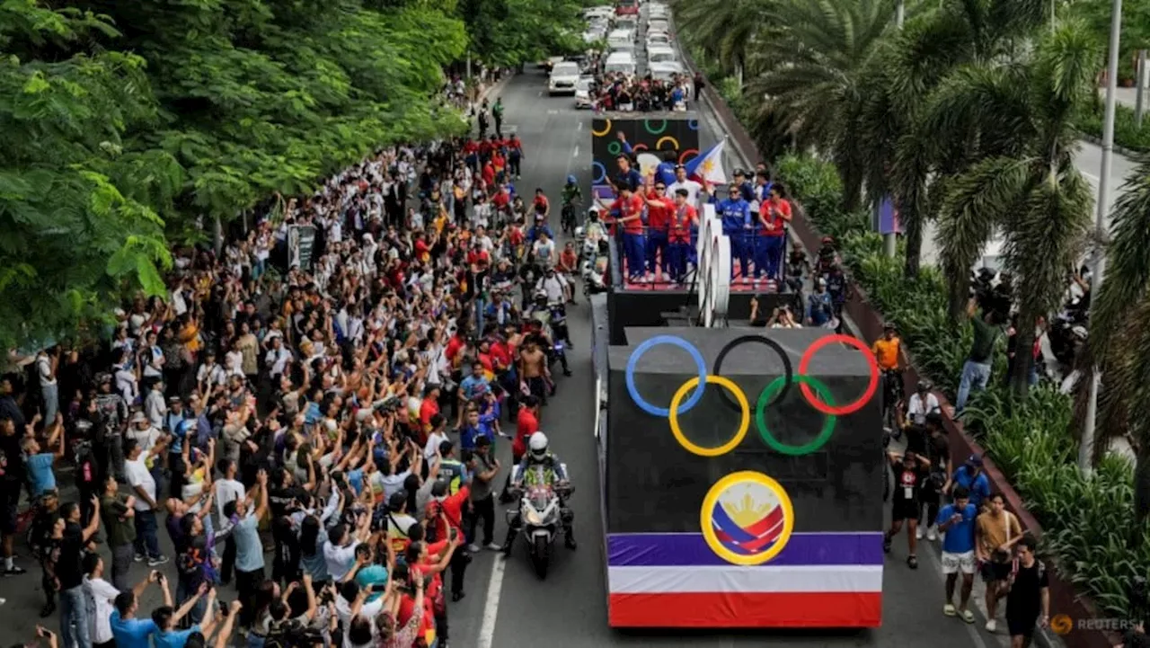 Philippines cheers gold medallist gymnast Yulo in victory parade