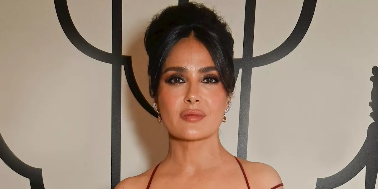 Salma Hayek Layered a Sheer Snakeskin Cover-Up Over a Plunging One-Piece