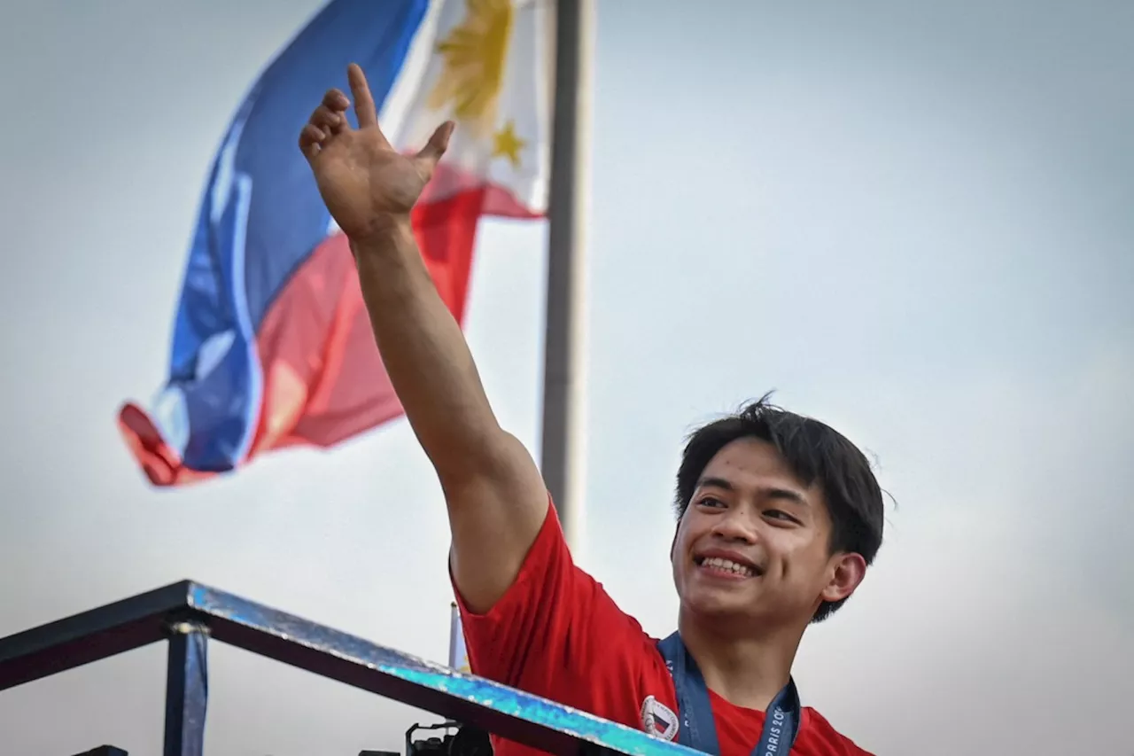 Philippines holds victory parade for two-gold Olympic gymnast Yulo