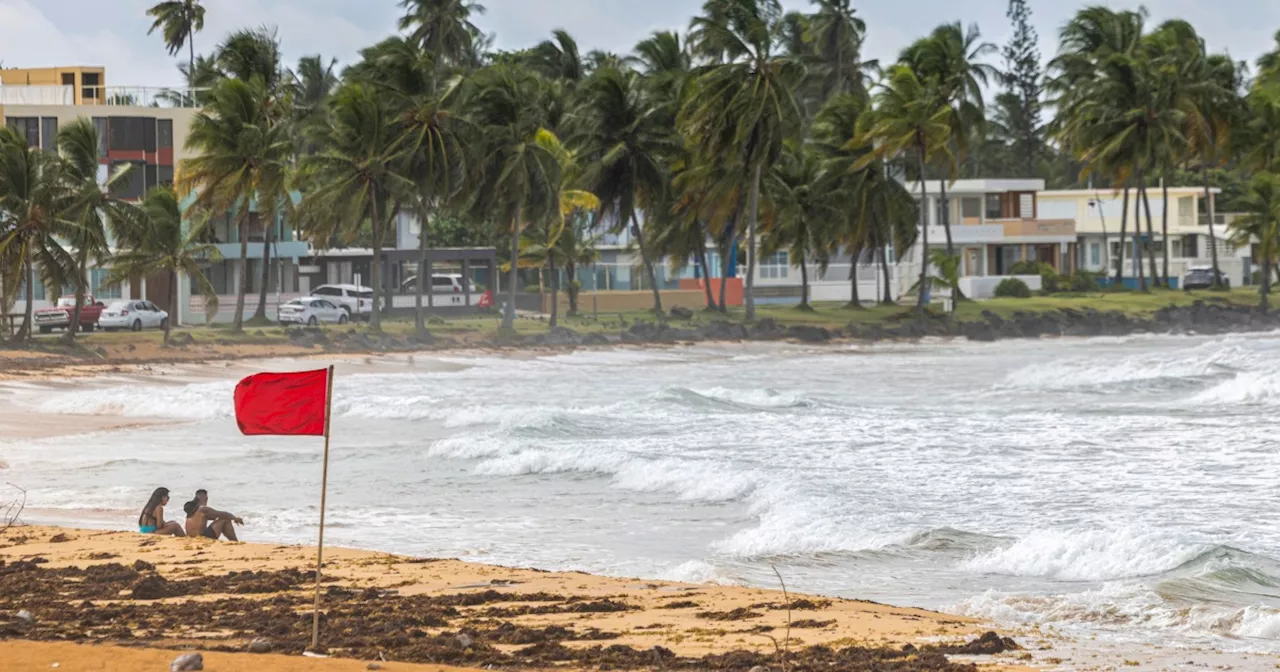 Thousands in Puerto Rico without power and under flood threats as Ernesto turns into a hurricane