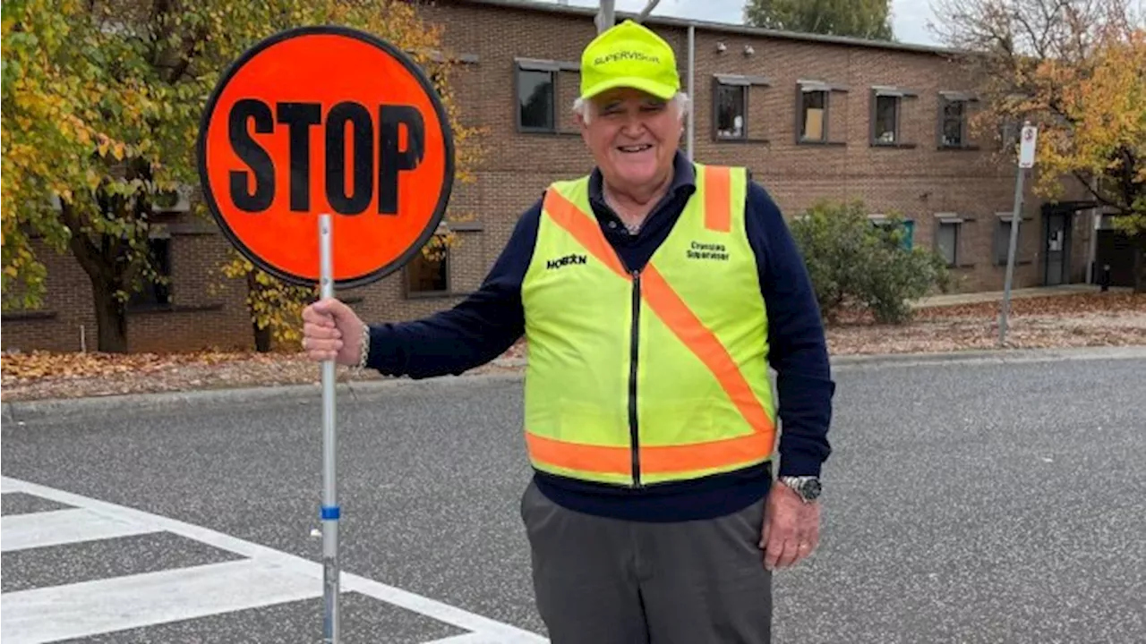 ‘Beloved’ school crossing supervisor cops high-five ban after parent complaint