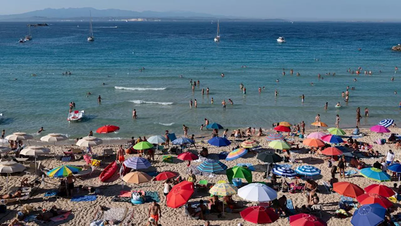 Italy imposes beach rules and selfie stop lights as tourist numbers hit peak levels