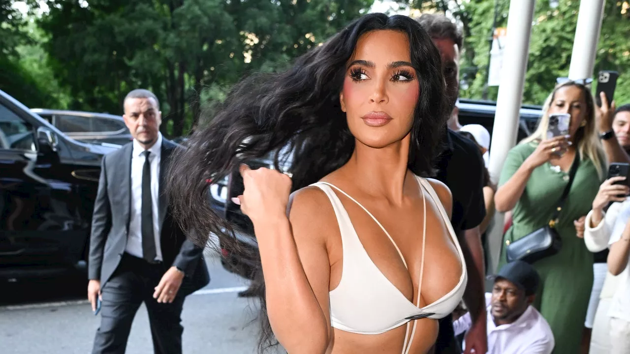 Kim Kardashian Makes Like Paris Hilton and Accessorizes With a Tiny Dog