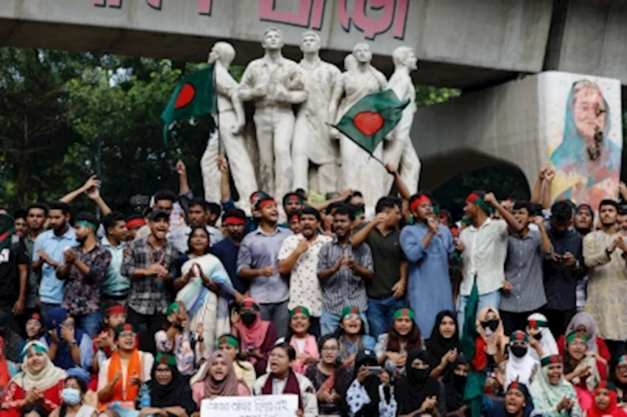 Armed with bamboo rods, Bangladeshi students patrol against ‘chaos’ planned by supporters of exiled Hasina