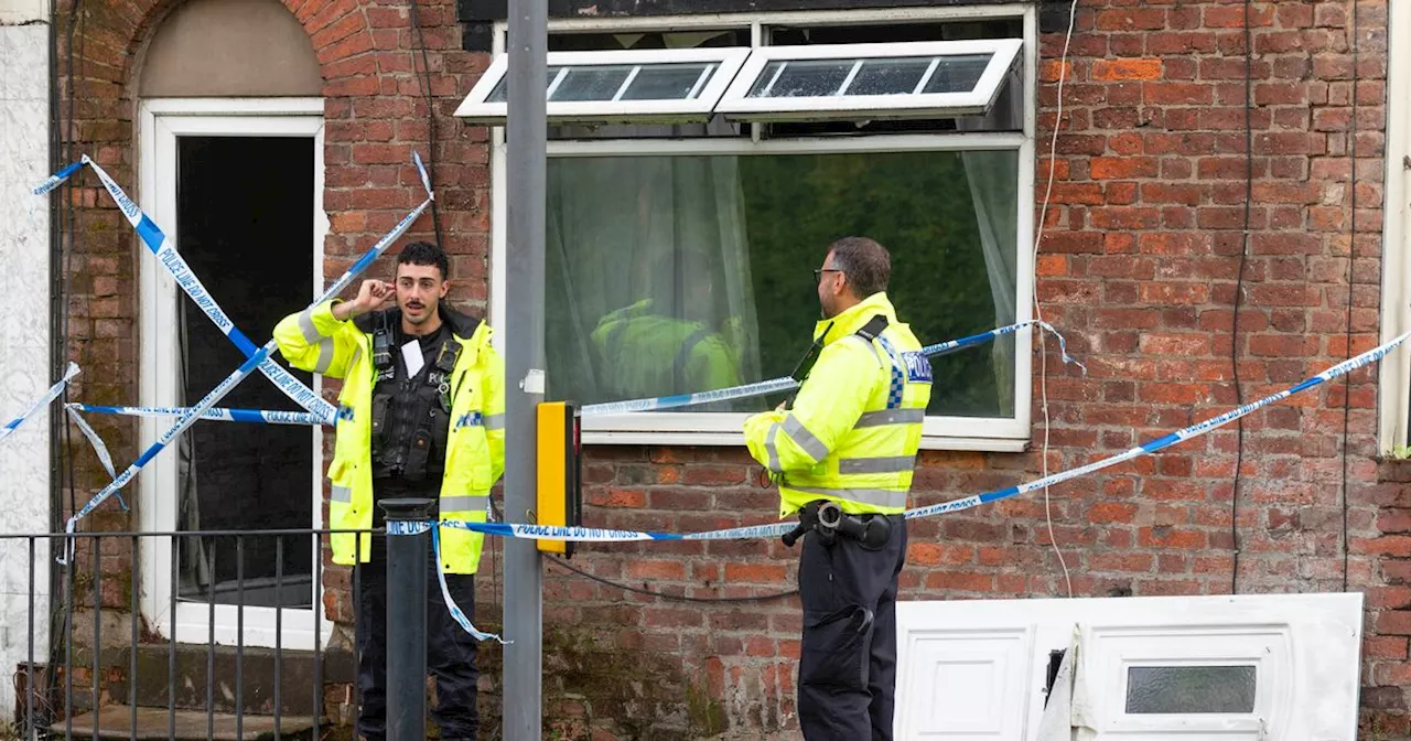 Police guard house after emergency services swarm road near Trafford Centre