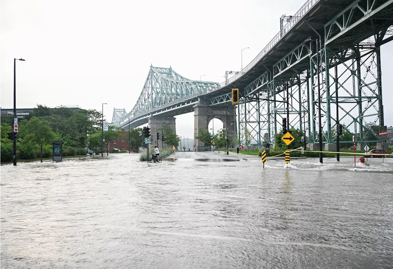 Major water main break floods streets near Montreal’s Jacques Cartier bridge