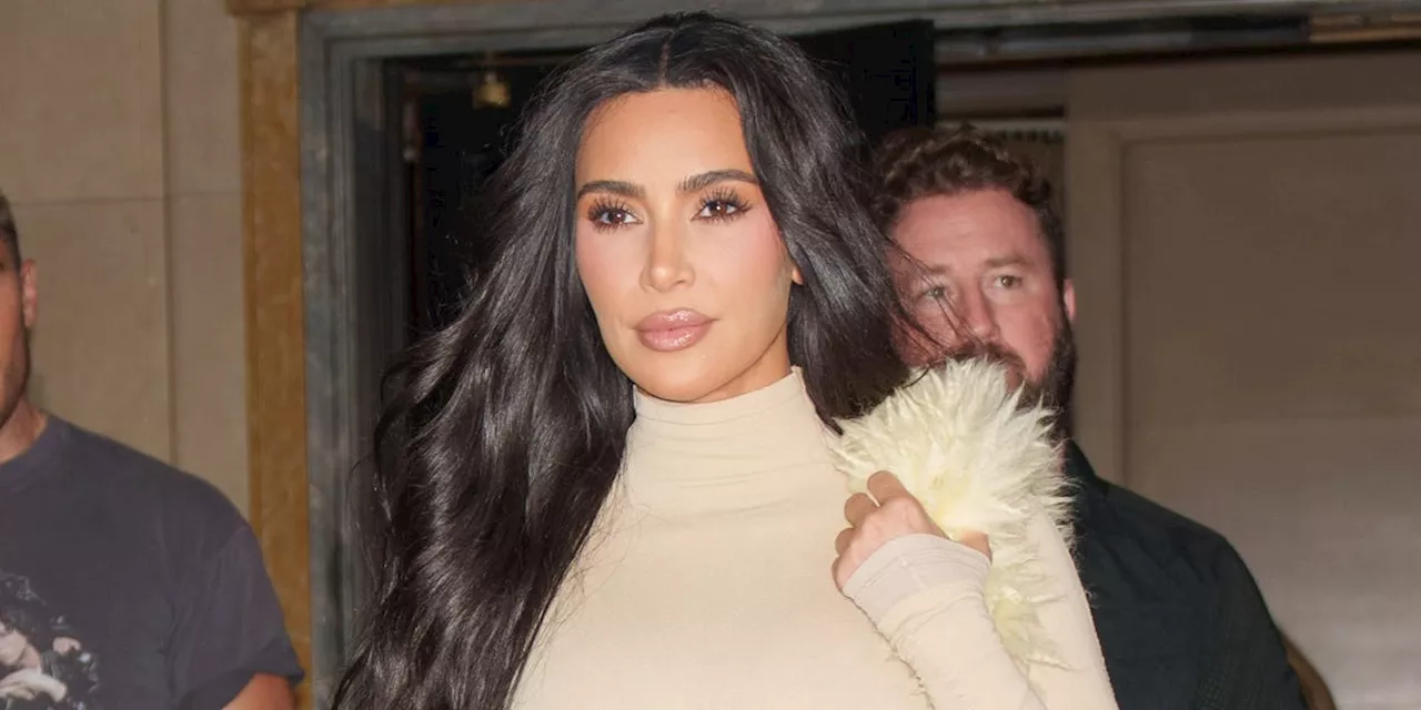 Kim Kardashian Adds Some Fun to Her Monochrome Look With a Furry Yellow Bag