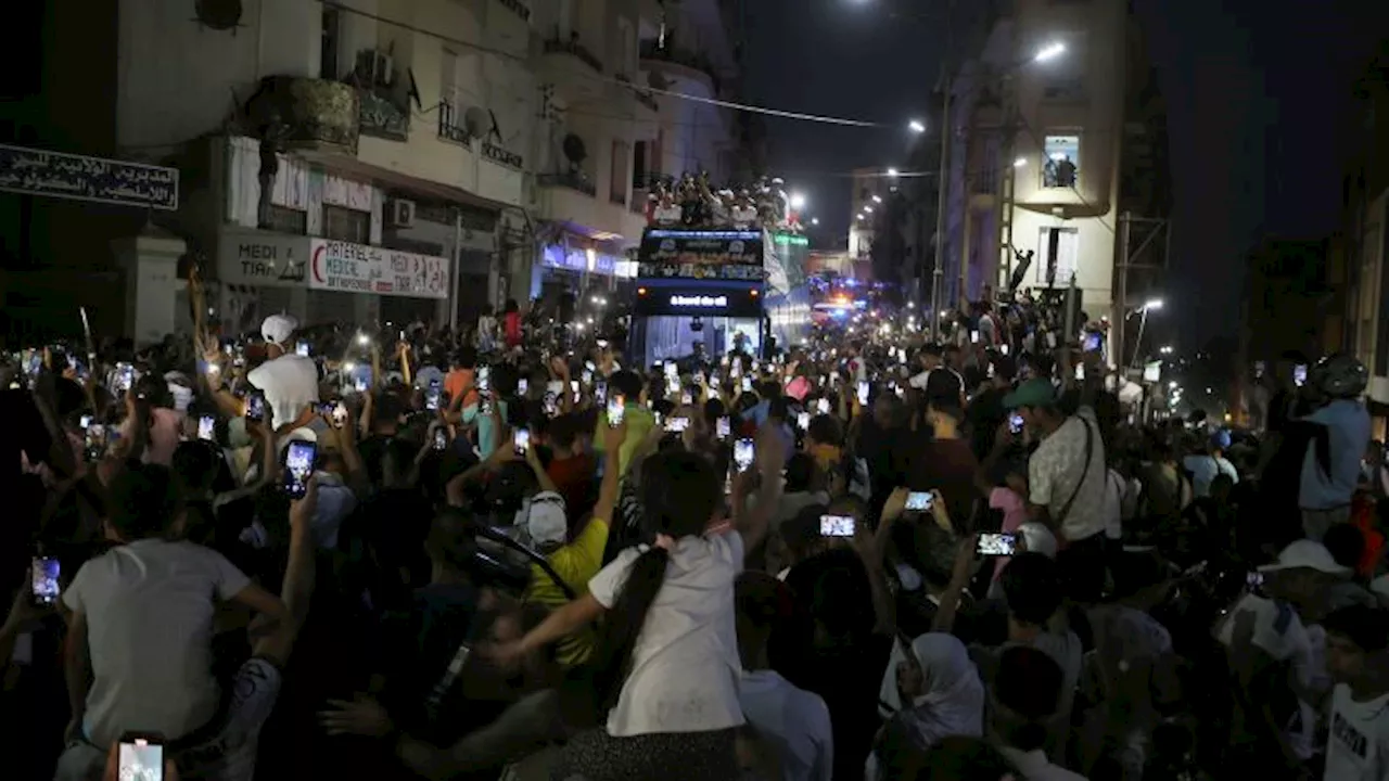 Algerian boxer Imane Khelif honored by celebratory parade on return home from Paris Olympics