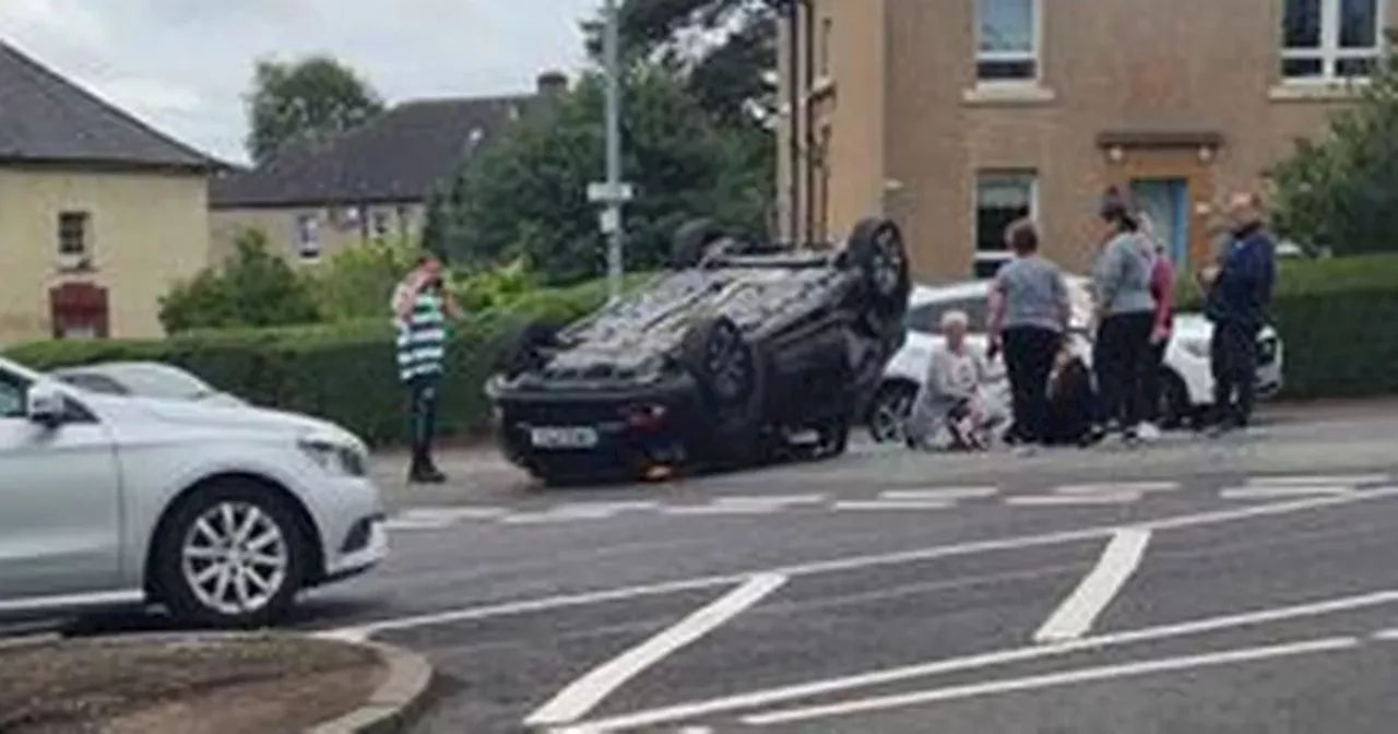 Glasgow road closed as car flips on roof as emergency services rush to scene