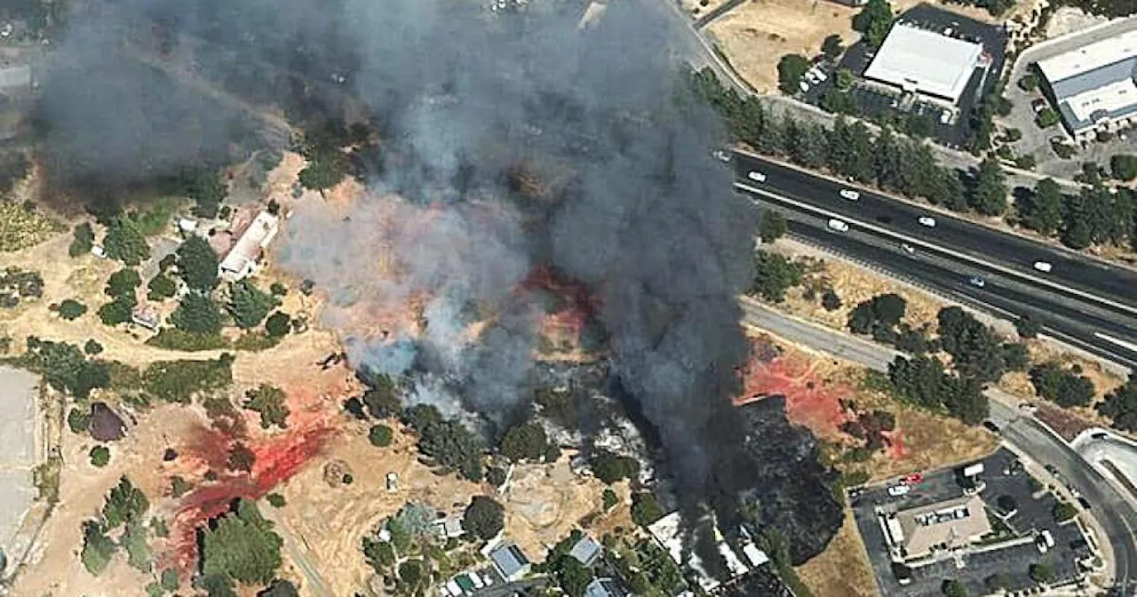 Fire destroys Sierra foothills motorsports business; woman accused of arson