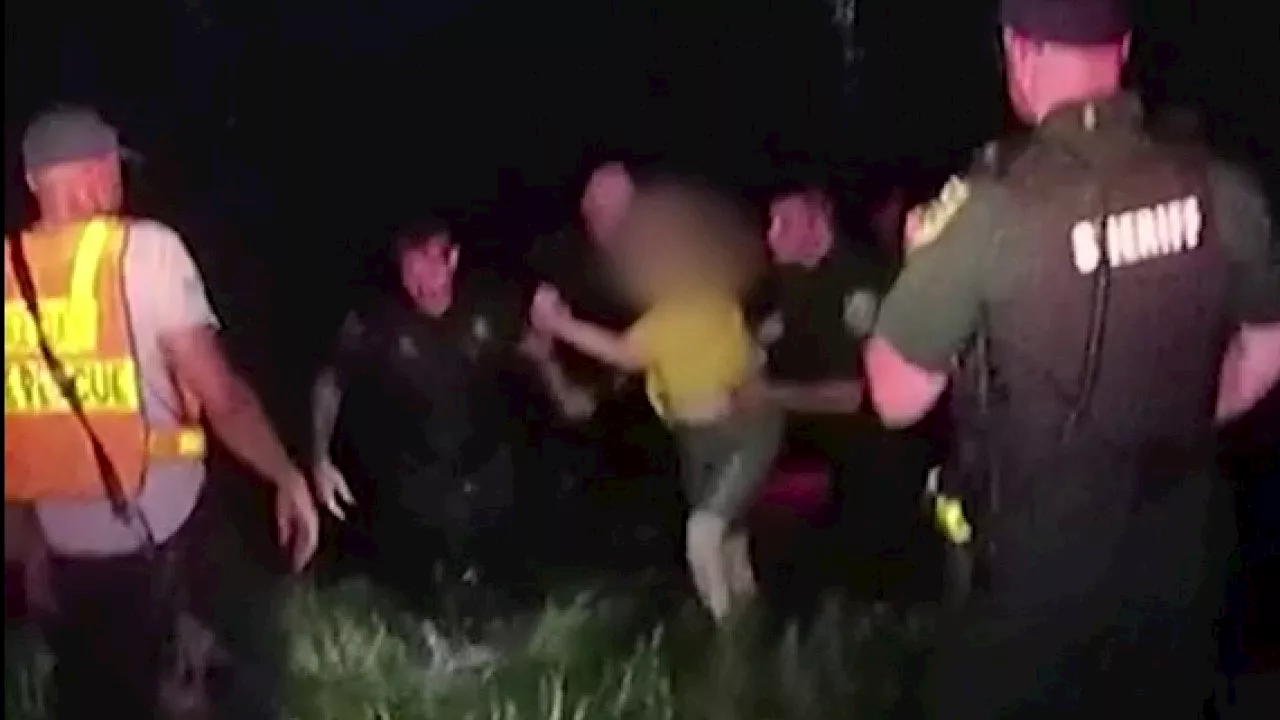 Florida deputies dive into lake to save woman trapped in fully submerged car